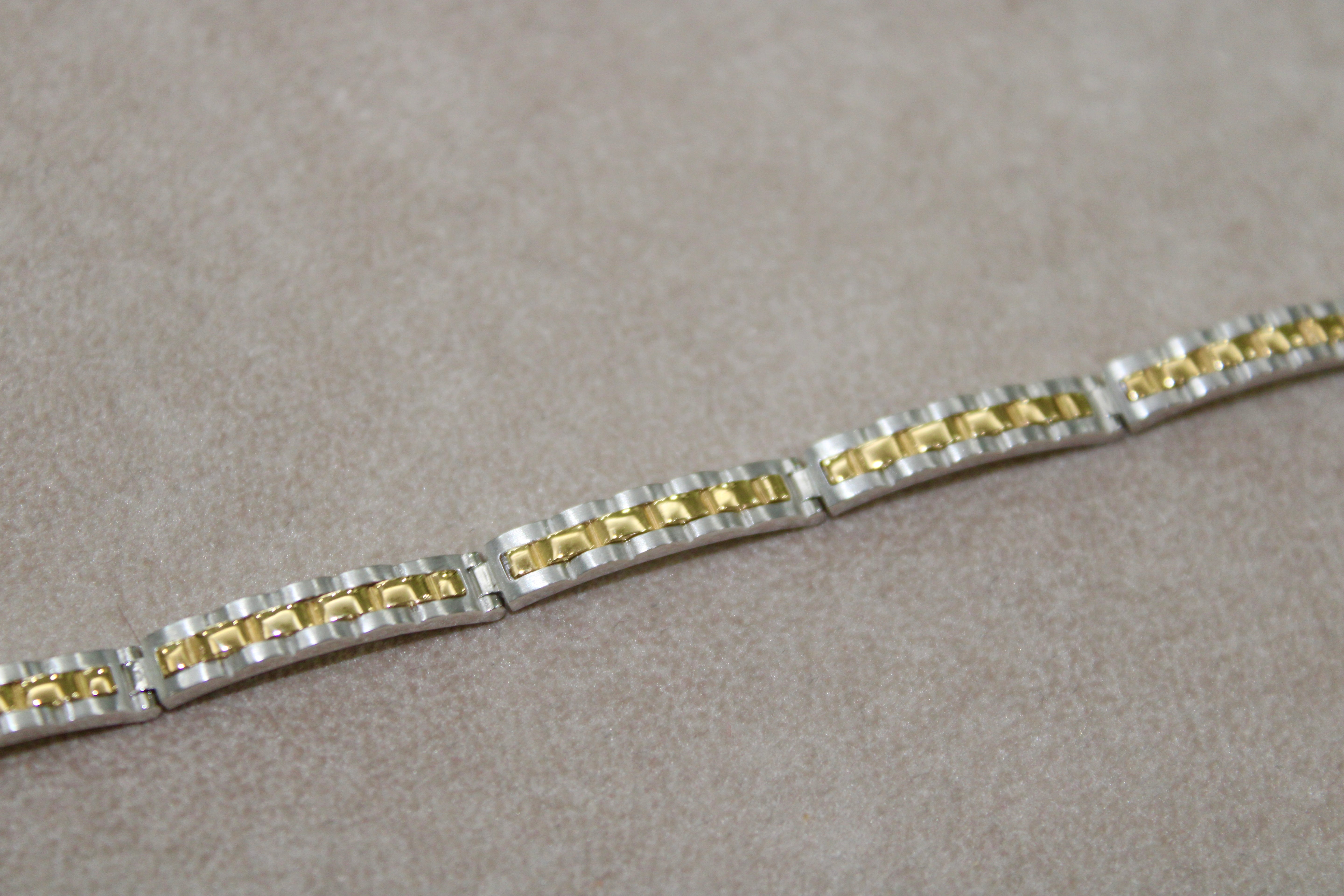Bracciale rigido bi-colore in oro 18k
