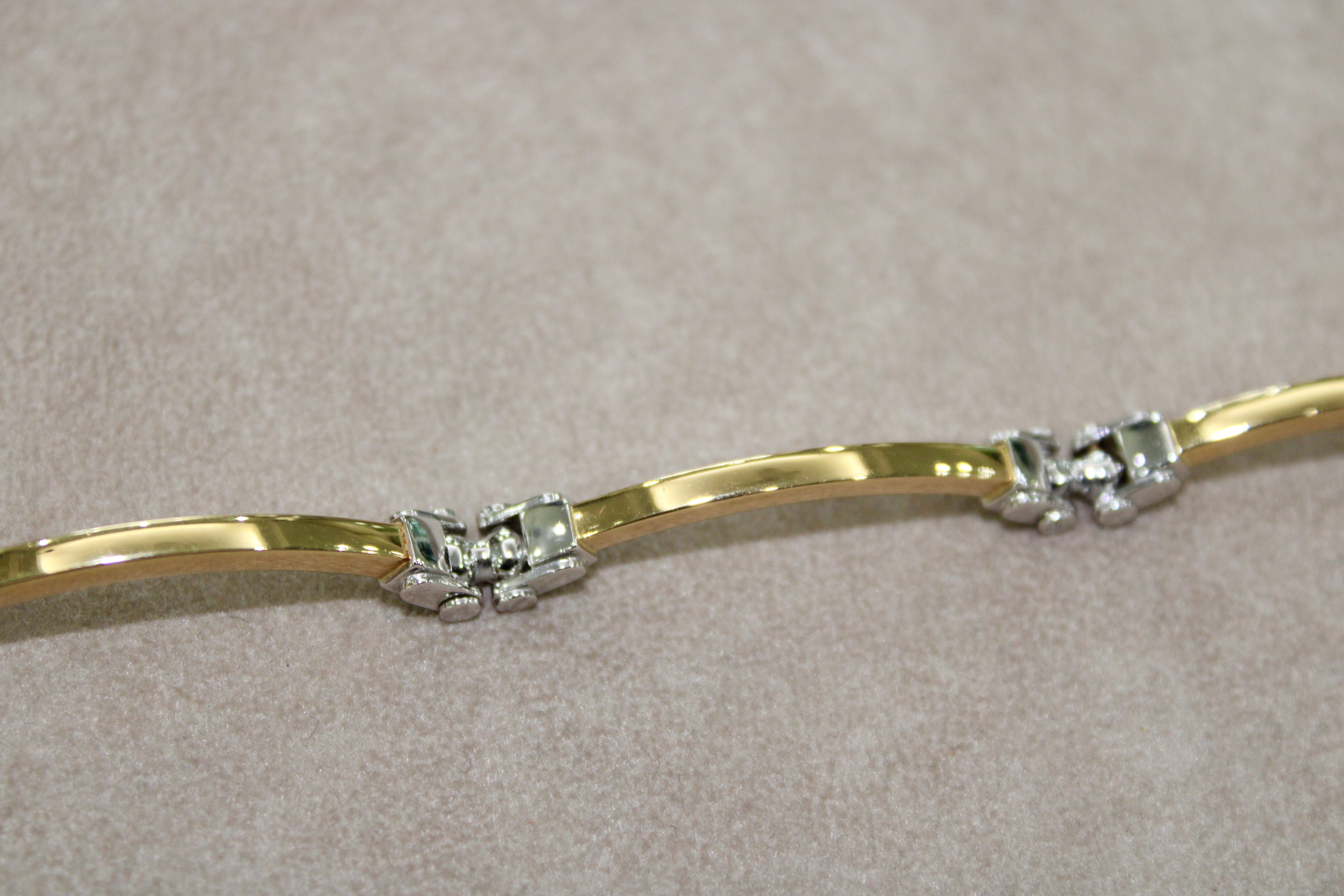 Bracciale rigido bi-colore in oro 18k